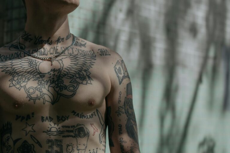 close up shot of a man s chest with tattoo